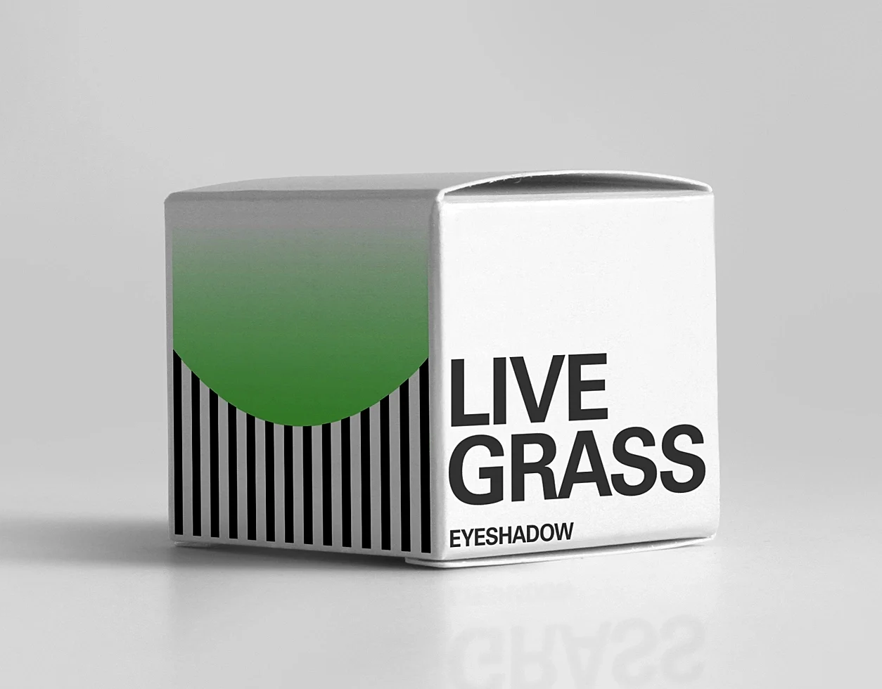 Makeup box, green eyeshadow with a graphic shape and the company's brand