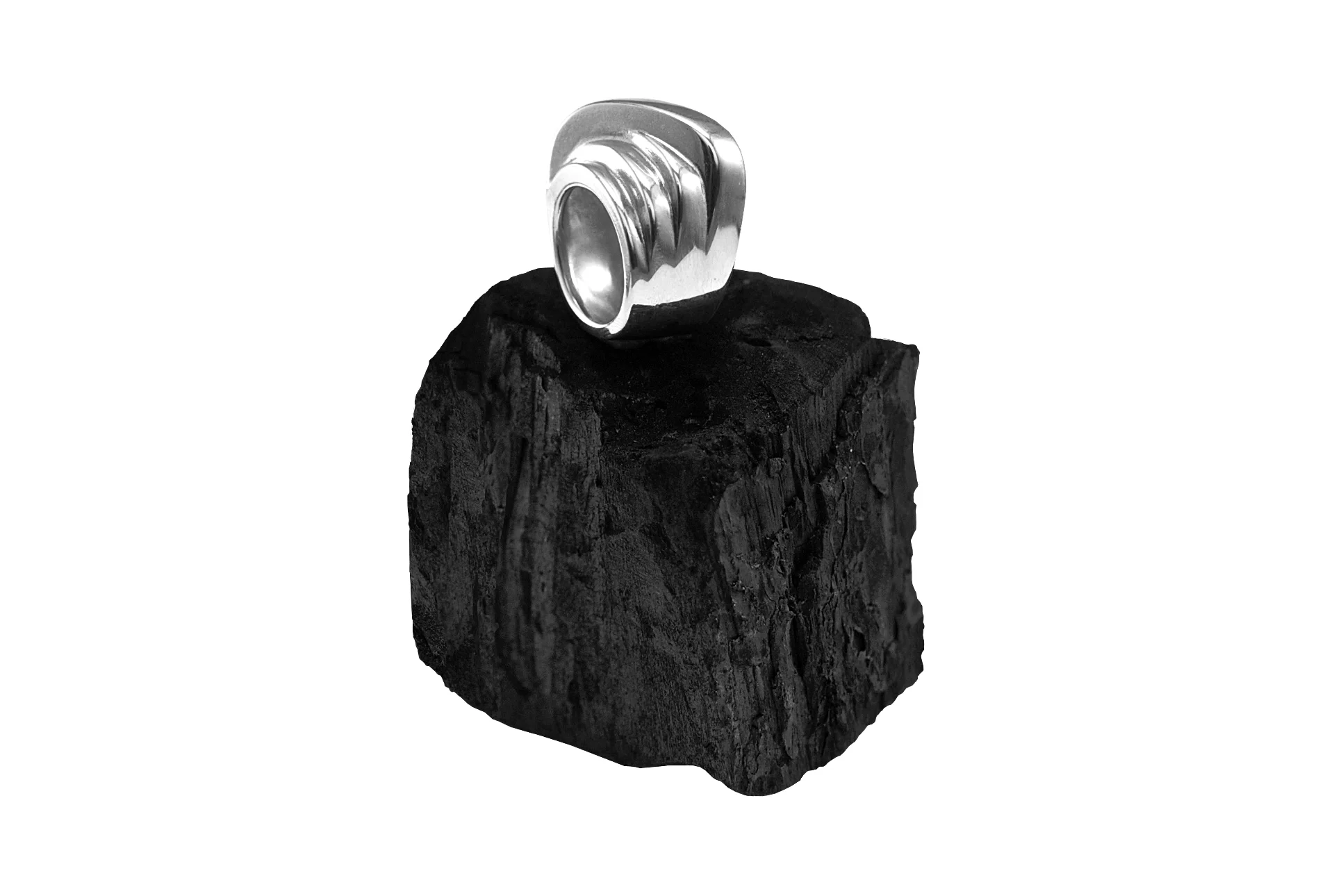 Photography of a jewel placed on coal