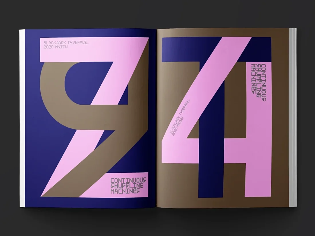 Open book with letters set in pink, gold and dark blue